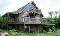 ENJOY THE SERENITY THIS 2005 YEAR ROUND CONTEMPORARY OFF THE GRID HOME OFFERS WITH 180 DEGREE MOUNTAIN VIEWS. SOLAR PANELS,TURBINE, GENERATOR,& PASSIVE SOLAR. VAULTED CEILINGS, GRANITE WALL & HEARTH WITH WOODSTOVE. WOOD OR TILE FLOORS. FULL WALK OUT