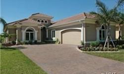 Enjoy this Valencia model in the private enclave of Santa Lucia in Grandezza Community in Estero florida. Gorgeous lake and golf course views from the lanai enjoy the heated built-in pool/spa. European kitchen with wood cabinetry and crown molding,