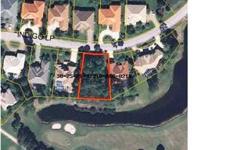 Beautiful Lakefront home site with golf course views located almost at the end of a cul-de-sac in the prestigious gated community of Emerald Bay. Emerald Bay has a championship 18 hole golf course, central location to the Gulf of Mexico, Mid-Bay Bridge,