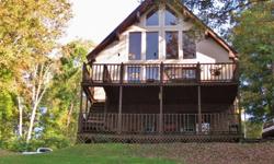 Beautiful Lake Front Chalet with 1.5 acres just off the Main Channel of Boone Lake. Features 3 Bedrooms and 2.5 Baths, Large Living Room, Large Den with stone fireplace, 2+ car garage, workshop, private office, double deck boat dock with electric lift and