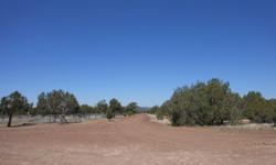 2.09 ac next to Kaibab National Forest, not near, but next to. Corner property with electric, fenced north & west. 57 more pictures can be viewed at