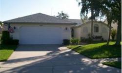 Lovely Madison Model shows GREAT!!! This home has new tile flooring throughout, new vanity in guest bath any more. Sellers are Motivated. Between the screened atrium and enclosed Florida room and large covered lanai with screened birdcage, Florida living