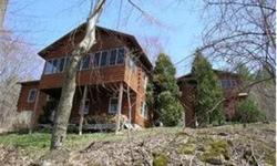 This high-end Northeast Log Home was customized to the owner's needs when constructed and has been well maintained inside and out since. It is nestled in the trees on a 25 acre hillside lot and has seasonal western views that could be improved with a