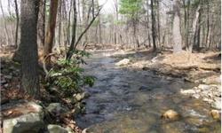 Simply the Best! 20 acres located in the exclusive 10,000 acre mountain community of Aston Woods. Sawmill Run flows through the middle of this 100% useable lot. 500ft driveway installed to building site by stream. Hardwood ridges, pines and freshwater