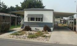 Really nice 2 bedroom, 1 bath mobile home, with beautiful puergo floors, nice appliances and convenient to many publice services, including retail, grocery, banking, public transportation and pharmacy. Covered carport and covered front porch.Listing