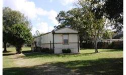 Non-subdivision, no deed restrictions. Nice mobile home sitting on approximately one acre. Appears much larger than a single wide. Kitchen opens onto the large great room. Spacious master bedroom with walk-in closet, master bath has separate vanities &
