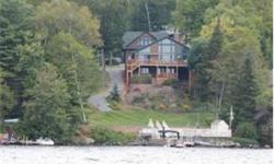Magnificent home on Lake Sunapee, sunrises, mountain views, screen porch, sheltered from the wind, large deck at water's edge, permanent dock, a/c, great for year-round living. Beautiful landscaping. Set up for handicapped. Totally renovated with new two