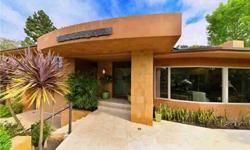 This Zen quality home exudes positive energy from the minute you walk through the David Ardle copper clad door with deep etching that mirrors the curves of the canyon, bringing your focus to the beautiful ocean view. Designed by well known architect Tim