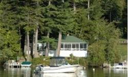 Winter Harbor Cottages with great western views and sunsets. This property has two large seasonal cottages with 7+ bedrooms in all. The main cottage sets within 30 feet of the lake with a wonderful full length screen porch to enjoy 180 degree views and