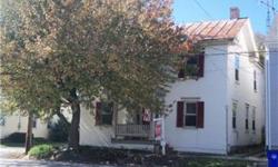 REDUCED ! Older home in small town with lots of potential. Numerous outbuildings, one could be an office or studio. Large KIT and large lot for in town location with fenced yard and close to town businesses and school. Being sold AS-IS. Great for a lover