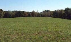 24.06 rolling acres. Ten acres grass field the remaining acreage is hard woods.