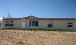 Large home with one level and open floor plan, nice kitchen and all good sized rooms, and pipe fenced. Mountain ciews from this 1 acre parcel set up for horses.Listing originally posted at http