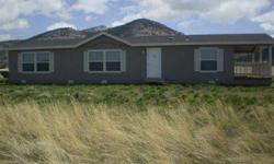 Come see this gorgeous 2008 Karsten (Northwest Energy Star efficient) MFH 1,512 sq.ft. 2bed/ 2bath with a den that was a third bedroom, it sits on 1.900 acres with panoramic views of Goose Lake & Warner Mountains. Home features