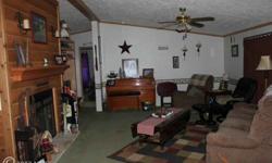 6 years new! 3 bedroom, 2 bath rancher on 2.5 acres. Spacious living room with wood burning fireplace. Master br with large walkin closet and attached bath with garden tub and double vanity. Kitchen/ dining combo with antiqued cabinets and large pantry. 2