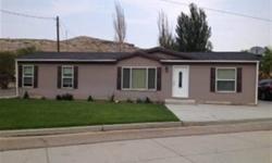 Great Floor Plan that is Spacious and well maintained! This modular home is on a permanent foundation and has off street parking and room for an RV. Bedrooms are large! Master suite has massive bathroom with soaker tub and lots of cabinetry! Home has a