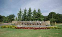 Serene two air conditioner(mol) wooded home site in an exclusive gated property.