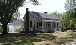 A Classic 1890 Homestead in excellent condition! 3 large bedrooms and 2 full baths, with 4th bedroom/office. Built on a level .9 acre lot surrounded by huge oak trees. Home has three working fireplaces and on central air and heat. Living room and bedrooms
