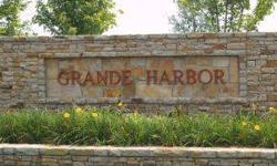 LAKE FRONT LOT !! Centrally located in the prestigious Grande Harbor subdivision. Neighborhood features Club House with events and exercise room, BEAUTIFULLY landscaped pool and relaxation area, walking trails, and paved streets, sidewalks throughout.