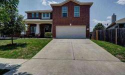 Look no further! Lovely 4 bedroom, 2.5 bath, 3-sides brick home with open floorplan and designer touches is ready for new owners. Island kitchen with hard tile and upgraded 42" cabinets. Huge breakfast room. Formal dining would also make perfect study.