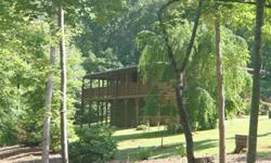 Beautiful log-sided home on private 2.29 acres. Just across from Lake Chatuge between Hayesville NC and Hiawassee GA. Stone front, gas-log fireplace in livingroom, 2 bedrooms/3 baths. Full unfinished basement. Wrap around Porch. Detached Garage.