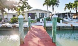 www.KeysRentalsOnline.comBeautifully Updated 2 Bedroom, 2 Bathroom Half Duplex on Key Colony Beach in the Florida Keys7 day Minimum RentalStay at your own tropical retreat; a place to relax, recharge and have some fun. Fish at your private 50 foot dock