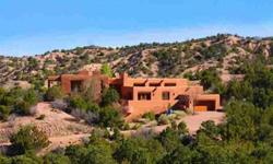 Stunning views and timeless finishes complete this adobe residence in the hills above Tesuque. Located in the extremely private Los Caminitos community just minutes from the Santa Fe Opera, Encantado resort and a short drive from downtown Santa Fe this