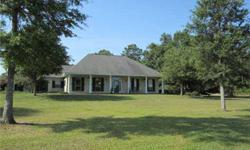 houses 100 yr old oaks, ponds and serene views. Rustic 4 bed, 4 bath home with wood floors throughout (exc in wet areas), designer white washed cypress walls & screened porch. 3 bed, 1 bath guest/caretaker home, 2 great barns(12 & 9 stalls), round pen,