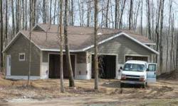 New 4 BR, 3 BA home,features vaulted ceiling with black ash T&G and red oak wains- coating in bsmt. Triple att. garage, wooded acres, 2 miles from Bemidji.Listing originally posted at http