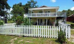 GENTLEMAN FARMERS LOOK NO FURTHER! THIS WONDERFUL MINI-FARM IS LOCATED ON 2.3 FENCED ACRES IN A VERY QUIET, PEACEFUL AREA CONVENIENTLY LOCATED NEAR LEESBURG AND THE VILLAGES! THIS TWO STORY HOME FEATURES 2 SEPARATE LIVING AREAS, ONE ON EACH FLOOR WITH A
