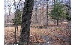 Reduced. Priced to sell. Nice 2.1 acre level building lot on Buck Hill Rd. Unrestricted. Mobile homes OK. Natural spring on property. Paved driveway. Approved class II septic. Motivated Seller! All offers considered!! Seller financing available!