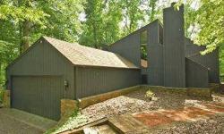 A unique and versatile floor plan and a private lot combine to make this a special offering for the right buyer. The house perched up on a wooded cul de sac was built in 1977 and significantly remodeled in 1998. The exterior is wood (most recently painted
