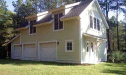 Wonderful opportunity to buy a charming Lowcountry Carriage House with Living Area, Kitchen, Bedroom and Bath over a 3 car garage ~on a gorgeous .69 acre lot on deepwater. Built in 2002, with pine floors, vaulted pine ceiling and beautiful views of the
