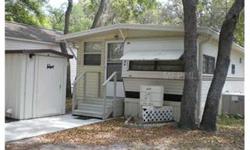 Nice home in a mobile/RV park where you own the land. Extension off home for added square footage, newer appliances. Front and rear entrances, utility shed with washer/dryer hook ups. Community includes; public swimming pool, convenience store, shuffle