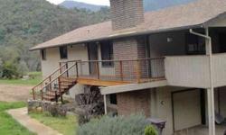 Located on Dinely Drive on the Bank of the Main Fork of the Kaweah River. Large Deck looks out onto the river and covered side deck would make great sun room. Top Floor includes large living room with fireplace, 2 bedrooms including master bedroom.