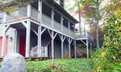 Beautifully maintained cottage with great mountain view in Lake Toxaway Estates. All the living you need is on the main level with guest rooms on the lower and the upper floors. Wood floors, rock face fireplace and a lovely deck where you can experience