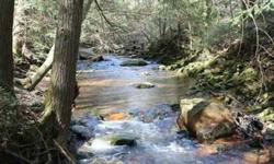 6.08 Acres - Owner financed Tennessee land with a nice sized creek running through it. This land has loads of road frontage and over 1000' of creek running through the middle of the property. Power is on the property and there is also a road leading down