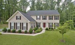 THIS HOME SCORES A 10 INSIDE AND OUT.LOADED W/UPGRADES & the Dream Kitchen you've been looking for all on 2.8 open & wooded level acres.Hardwood floors & custom upgrades throughout.Open foyer w/waterfall staircase.Granite & GE Profile Stainless gourmet
