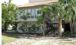 12 homes to Siesta Beach. Corner lot with 2 car carport. Lower level 11 x 8 greets you. This 3 level home boasts second level kitchen, dining room, living room, 2 bedrooms and a bath. Bright third level master suite, 23 x 12 with cathedral ceiling with