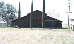 This ranch property is set up as a full horse training facility. 21 stalls with many outside pens & paddocks. Large arena 2 round pens, hot walker, wash rack, shop, covered hay storage shed. 2 homes.
Listing originally posted at http