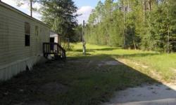 JUST SHY OF 7 ACRES. ENOUGH CLEARED SPACED FOR HORSES. VALUE FOR THIS SALE IS IN THE LAND. MOBILE HOME SELLING AS IS. THIS IS A RURAL AREA AND THERE IS NO HOA OR DEED RESTRICTIONS. ABOUT A 20 MINUTE DRIVE TO HOSPITAL AND SHOPPING.Listing originally posted