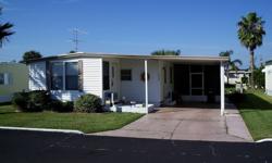 REDUCED! This property's owners have priced this comfortable home very attractively. You get a lot for the money. This mostly furnished 2 bedroom/2 bath mobile home is in popular Spanish Trails Village which is NOT a rental park! The front of the home has