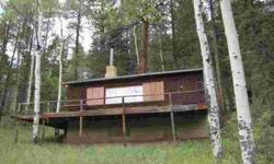 Sweet Grass Mountain Cabin on leased land in Santa Fe National Forest 19.4 miles above Pecos before the Iron Gate entry to Pecos Wilderness. Log Frame Cabin with full length porch, full kitchen, fireplace, wooden floors, beginnings of water catchment