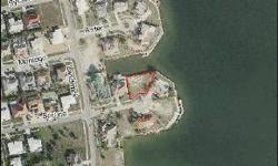 -LARGE GORGEOUS LOT WITH BRAND NEW SEAWALL WITH 150 FEET ON WATER. INCREDIBLE NORTHERN EXPOSURE VIEW. QUICK ACCESS TO GULF OF MEXICO. CLOSE TO BEACH, SHOPPING, AND RESTAURANTS. SEWER ASSESSMENT IS PAID. THIS IS A VERY SPECIAL PROPERTY AND AN OUTSTANDING