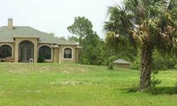 Where the Hawks soar high and the air is clear you will this 3 bedroom with a den/2 bath home custom pool home on 20 fenced acres. This worry free home features impact resistant glass, a Safe Room, whole house generator powered by propane & a 60 x 40