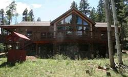 This one owner home built in 2003 has been lovingly cared for and features an 1163 sq ft workshop/man cave in addition to the 2580 sq ft of living space. A large wall of windows opens the view towards Eagle Nest lake and Baldy and Touch Me Not mountains.