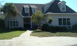 Beautiful Stucco home in Sea Palms Country Club on St. Simons island. Amenities include 9ft ceilings, formal dining room, great room with fireplace and built-ins, hardwood/tile flooring and crown molding throughout. Kitchen with custom cabinetry, granite