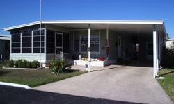This ?neat as a pin? 2 bedroom/2 bath furnished double-wide mobile home in popular Spanish Trails Village in Zephyrhills, Florida has it all! A great residence in a great subdivision at a great price! You will easily see that its owners are proud of their