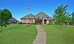 Hunters Creek, Edmond community with .60 acre (mol), Modern custom home featuring outdoor fireplace and grilling area Surprisingly family friendly op en great room w/ stacked stone fireplace. 4 beds down w/ media/playroom up.His & hers built in desks in