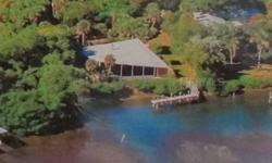 Beautiful Old Florida 1/2 acre bayfront property on the Sarasota County Line. On private road shared by 5 other property owners. Dock situated on almost 200 feet of waterfront directly on Lemon Bay. Deeded beach access to exquisite wide, extremely private