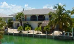 Location Location! Open water distant views. Short canal, straight shot out,wide canal,immediate ocean access. 100 ft. seawall, davits, fish cleaning table. Spacious 1620 sq.ft concrete block home. 210 sq.ft. of it is covered screen porch. Walk around